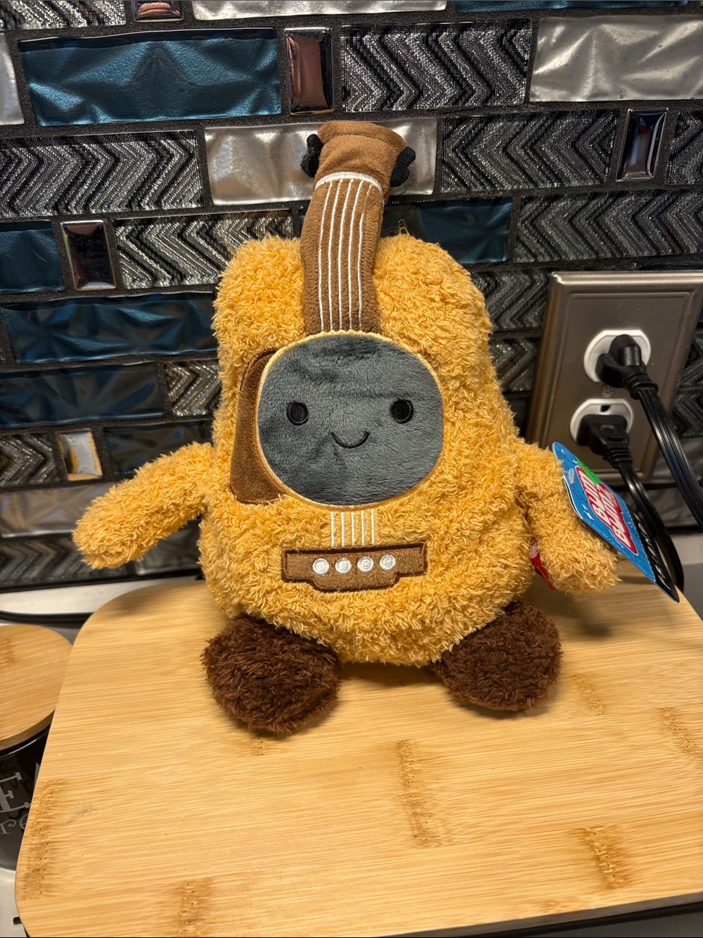 FRIENDS Plush Guitar Character in Yellow, Brown, and Gray